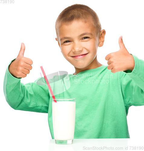 Image of Cute boy with a glass of milk