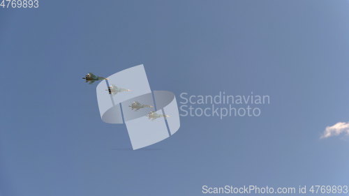 Image of Four bombers Su-34 fly in blue sky