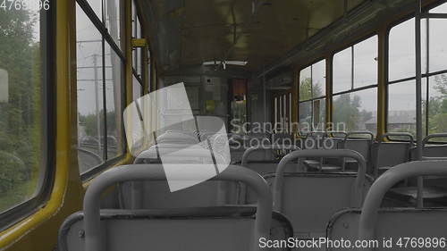 Image of An empty tram rides around town, view from the cabin