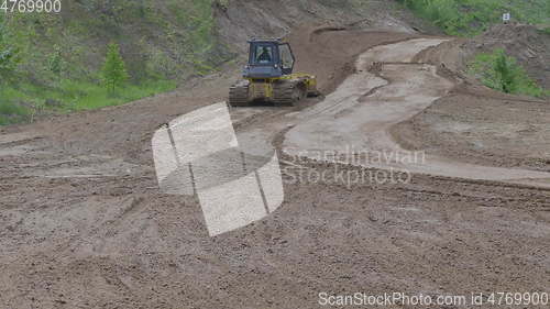 Image of Bulldozer on tracks at the mountain road construction. UltraHD stock footage