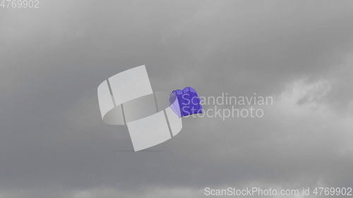 Image of Blue kite soaring in the sky