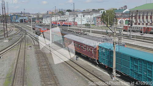 Image of BARNAUL - AUGUST 22: Cargo red train rides on the railway station on August 22, 2017 in Barnaul, Russia