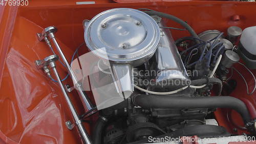 Image of Internal combustion engine of a red car close-up