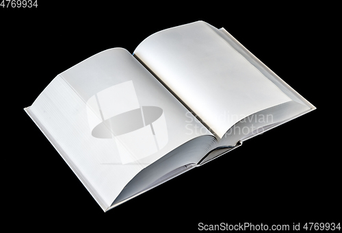 Image of Open blank dictionary, book isolated on black