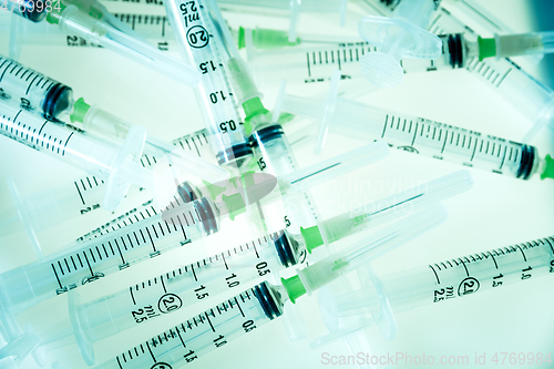 Image of Syringes on blue background