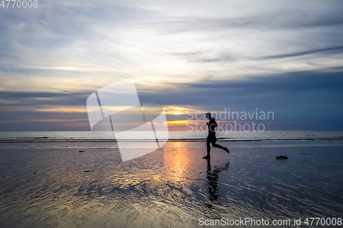 Image of Jogger on Nai Yang Beach at sunset, Phuket, Thailand