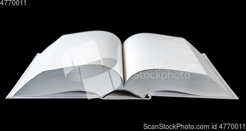 Image of Open blank dictionary, book isolated on black