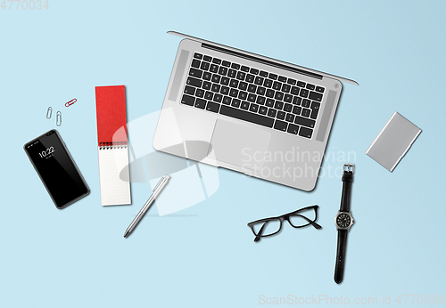 Image of Office desk mockup top view isolated on blue