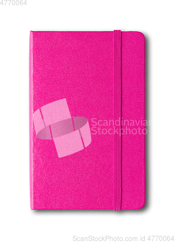 Image of Magenta pink closed notebook isolated on white