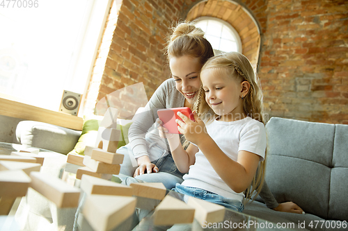 Image of Teacher and little girl, or mom and daughter. Homeschooling concept