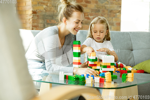 Image of Teacher and little girl, or mom and daughter. Homeschooling concept