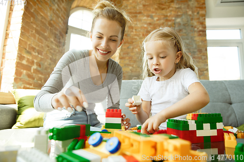 Image of Teacher and little girl, or mom and daughter. Homeschooling concept