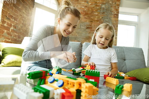 Image of Teacher and little girl, or mom and daughter. Homeschooling concept