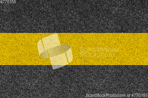 Image of Black asphalt background texture with yellow line