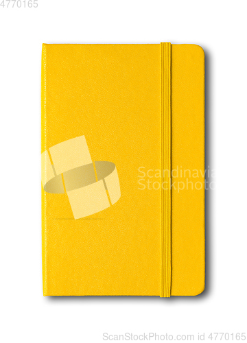 Image of Yellow closed notebook isolated on white