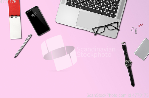 Image of Office desk mockup top view isolated on pink