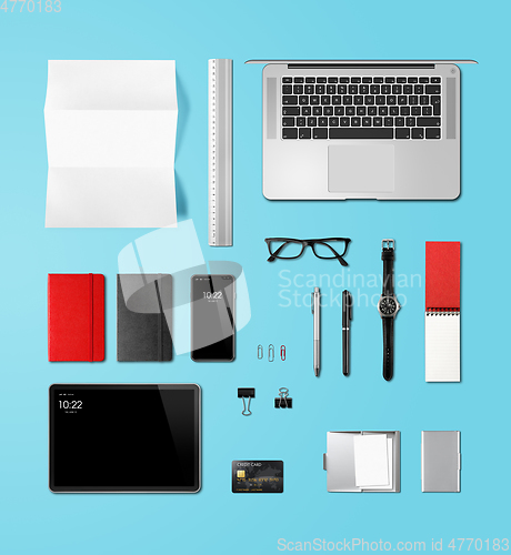 Image of Office desk branding mockup top view isolated on blue