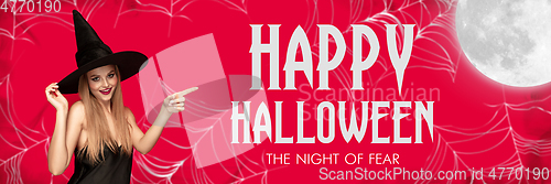 Image of Young woman in hat as a witch on scary red background