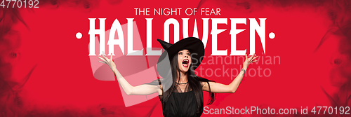 Image of Young woman in hat as a witch on scary red background