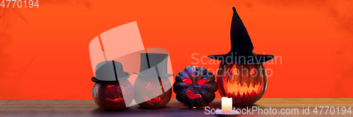 Image of Scary pumpkins on black background, the night of fear