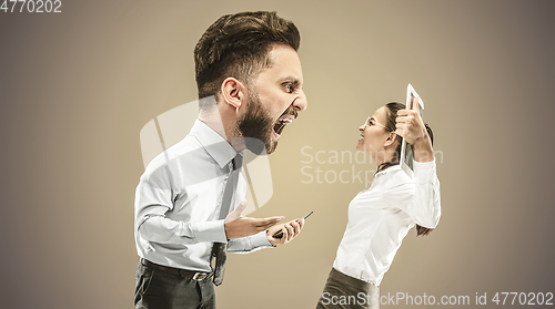 Image of Angry business man screaming at employee in the office