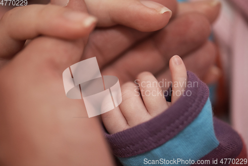 Image of mother is playing with baby at home