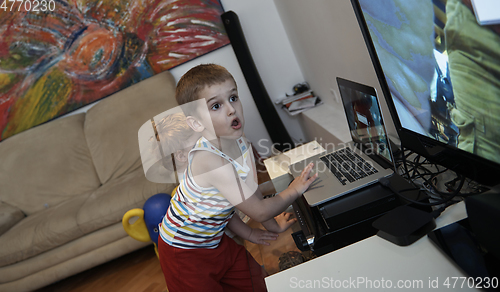 Image of Little child playing with sister at home