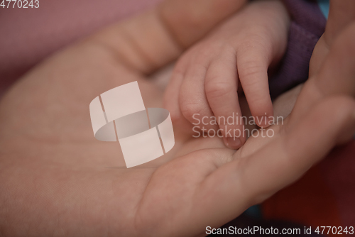 Image of mother is playing with baby at home