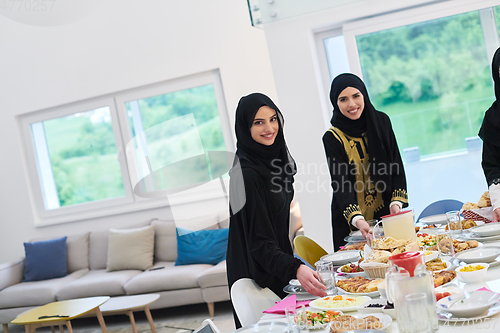 Image of Young muslim women preparing food for iftar during Ramadan