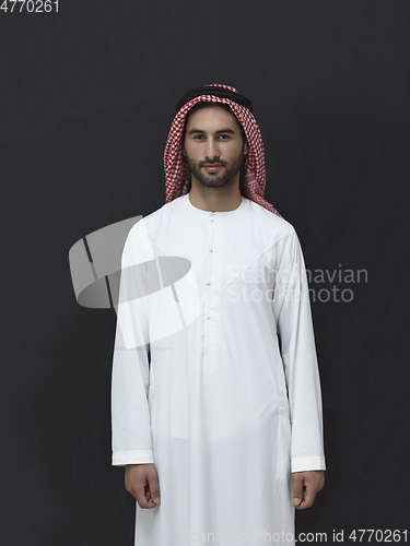 Image of Portrait of young muslim man wearing traditional clothes