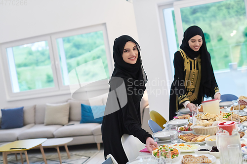 Image of Young muslim women preparing food for iftar during Ramadan