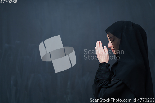 Image of Portrait of young Muslim woman making dua