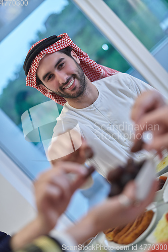 Image of Muslim family having iftar together during Ramadan.