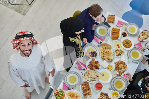 Image of Top view of muslim family having Iftar during Ramadan holy month