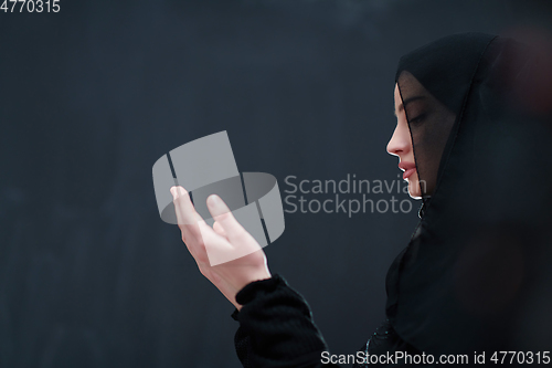 Image of Portrait of young Muslim woman making dua