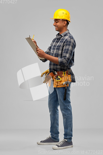 Image of happy builder with clipboard and pencil