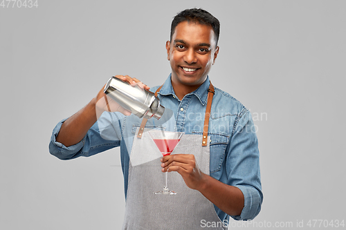 Image of indian barman with glass of cocktail and shaker