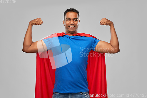 Image of indian man in superhero cape showing his power
