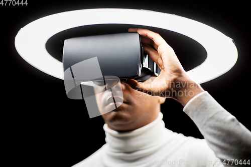 Image of man in virtual reality headset or vr glasses