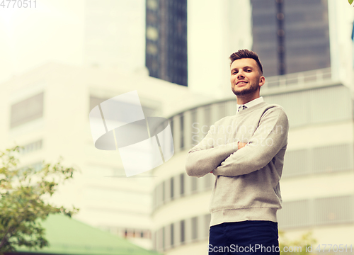 Image of young man on city street