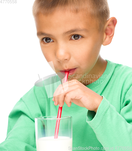 Image of Cute little boy with a glass of milk