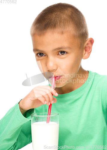 Image of Cute little boy with a glass of milk