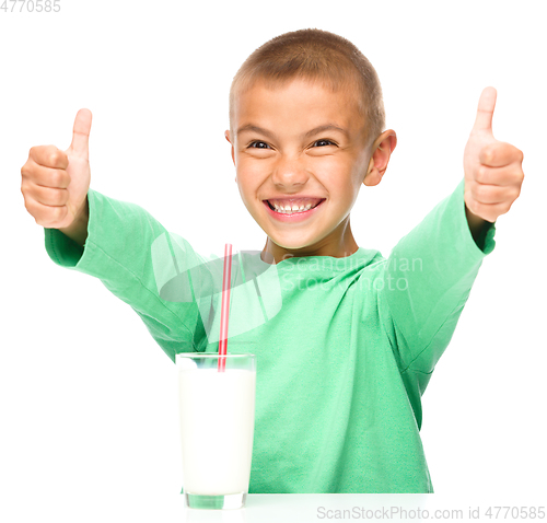 Image of Cute boy with a glass of milk