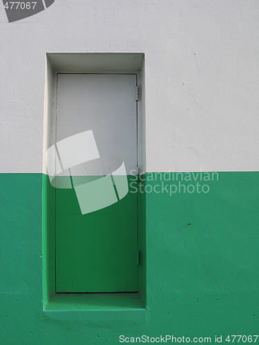 Image of door on a white and green building