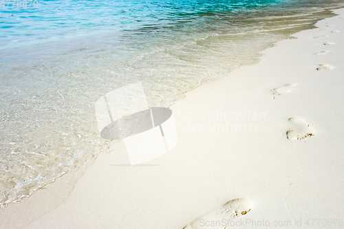 Image of footprints on a tropical beach
