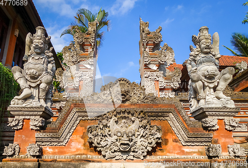 Image of Statues on a temple entrance door, Ubud, Bali, Indonesia