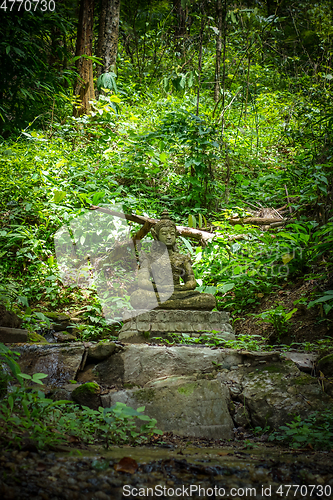 Image of Buddha statue in jungle, Wat Palad, Chiang Mai, Thailand