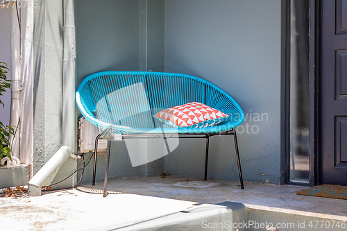 Image of turquoise seat in front of a house in Sydney Australia