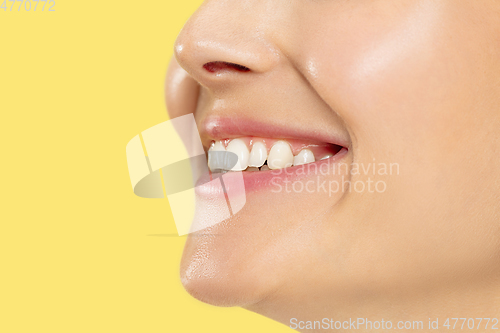 Image of Close up shot of young woman on yellow background
