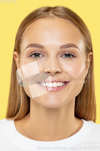 Image of Caucasian young woman\'s close up shot on yellow background